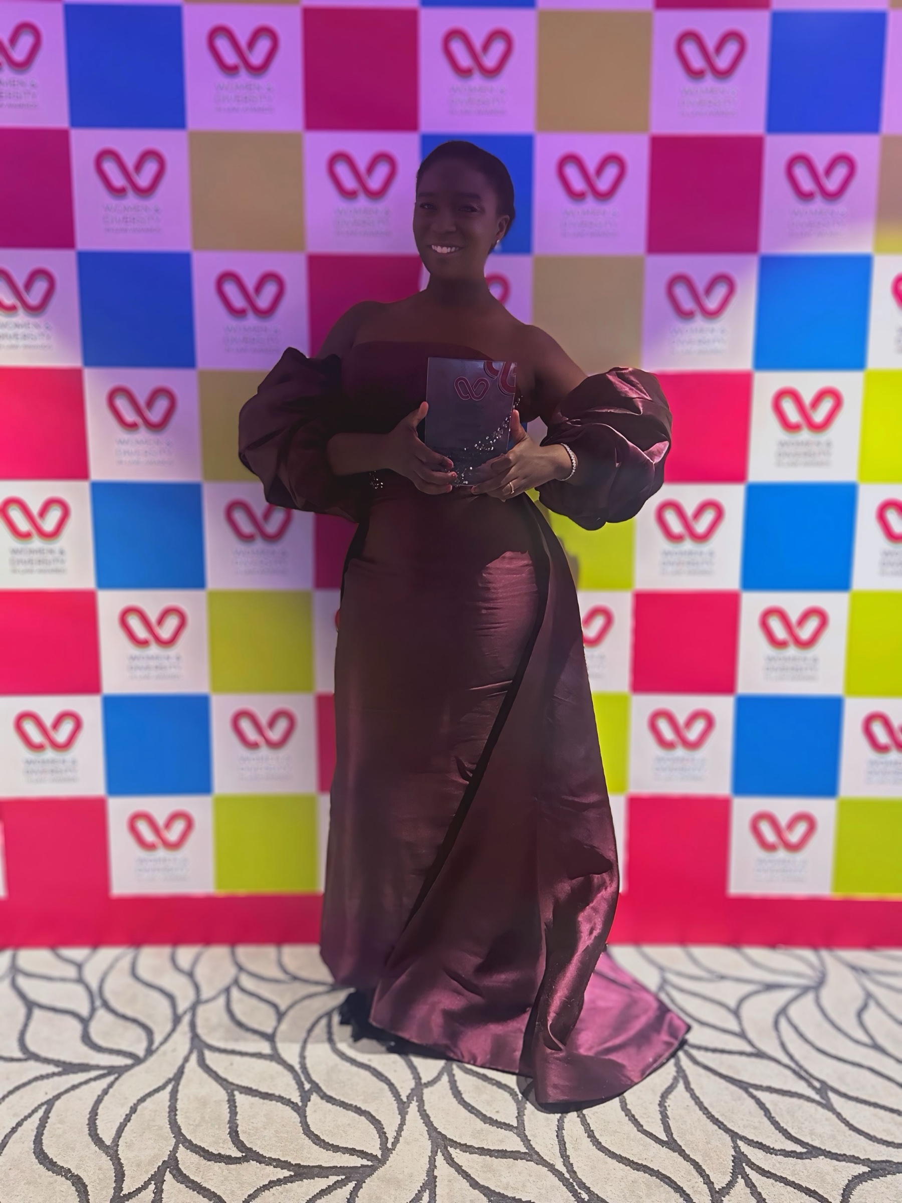 Karen Safo-Barnieh holding her Women and Diversity in Law Awards 2026 Rising Star trophy
